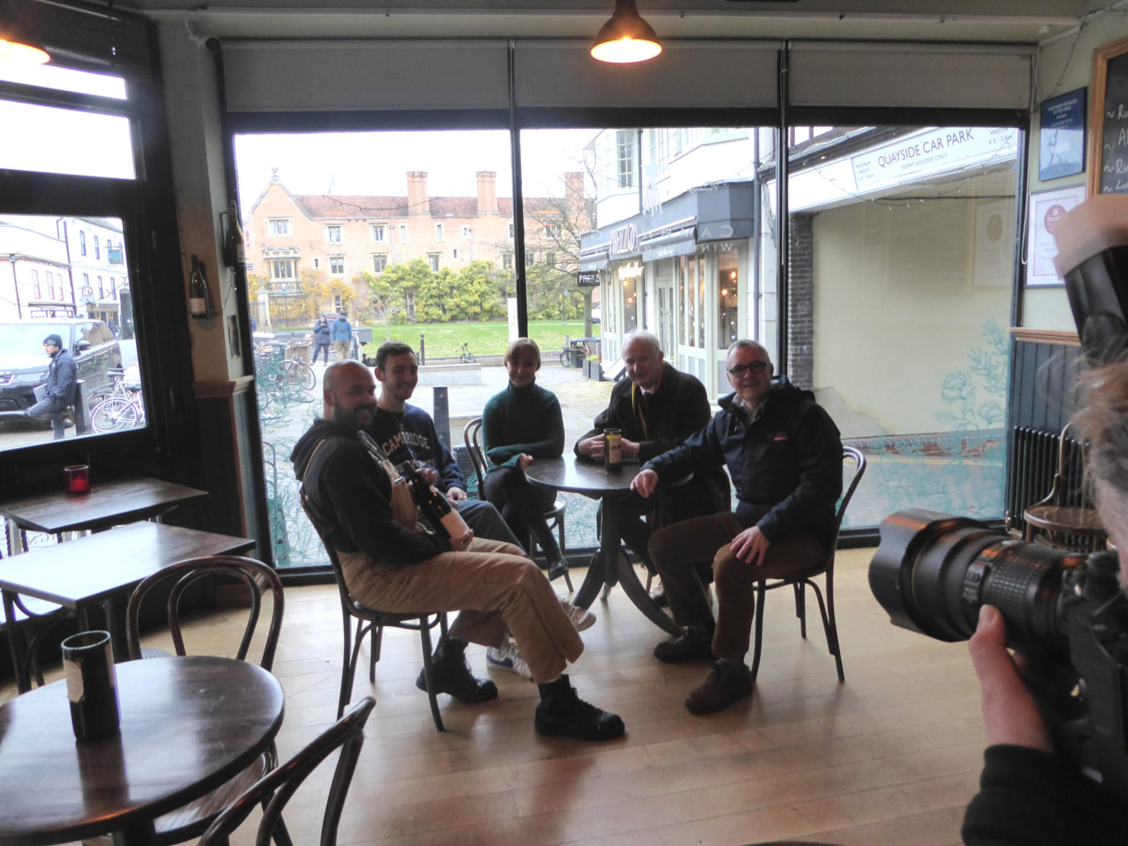 Daniel sitting with members of Cambridge Wine Merchants